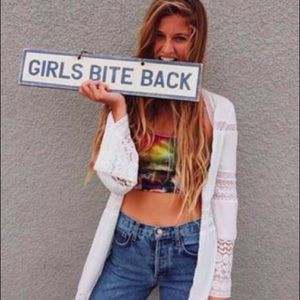 Brand Melville ‘Girls Bite Back’ rustic wooden sign.